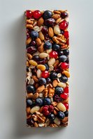 Healthy snack bar with mixed nuts, blueberries, cranberries and peanuts on light background. Natural protein and energy food closeup view.