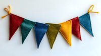 Colorful felt pennant banner with triangular flags in red, green, blue, yellow hanging on string against white background. Festive party decoration.