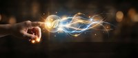 Hand touching glowing energy waves with light particles on dark background. Digital transformation and innovation concept for business presentations.