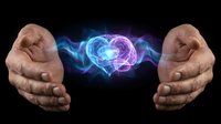 Human hands protecting glowing brain with electric energy waves on black background symbolizing mental health care and neurological protection.