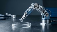 Precision robotic arm conducting laboratory analysis with pipette over petri dish in modern scientific research facility for automated testing procedures.