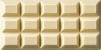 White chocolate bar with rectangular segments in a uniform grid pattern on cream background.