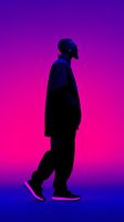 Silhouette of African American man walking in profile against vibrant purple and pink gradient background, creating dramatic contrast for music or fashion content.