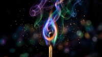 Colorful smoke swirls rising from wooden match stick against dark starry background with bokeh lights creating magical atmosphere for creative projects.