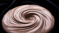 Creamy swirl of chocolate and vanilla frosting in spiral pattern, suitable for bakery, dessert, and confectionery design projects.