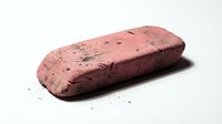 Isolated brick-colored sponge with porous texture and dark speckles on white background, ready for design projects, product mockups, and educational materials.