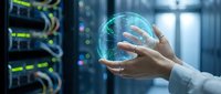 Hands holding glowing digital globe in server room environment, representing global network connectivity, data transfer, and cloud computing technology for business solutions.