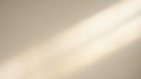 Soft beige gradient background with diagonal light rays creating warm minimalist texture for modern design projects and presentations.