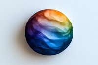 Colorful rainbow sphere with swirling watercolor texture on white background, featuring smooth gradient transitions from deep blue to vibrant orange. Isolated object for design use.