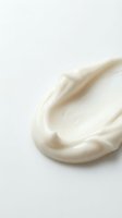 Creamy white cosmetic texture swirl on clean background for skincare and beauty product applications.