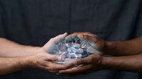Hands holding glowing digital network connections representing technology, communication and global connectivity in business and innovation.