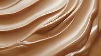 Smooth flowing waves of luxurious milk chocolate create elegant curves and folds with rich caramel tones and silky texture for confectionery and dessert designs.