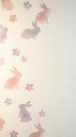 Watercolor rabbits and flowers seamless pattern in soft pink and purple tones on cream background. Repeating design for nursery decor and textile projects.