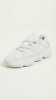 White chunky sneaker with mesh and suede upper, lace-up closure, and oversized sole on neutral background. Isolated footwear for design, fashion, retail, and e-commerce use.