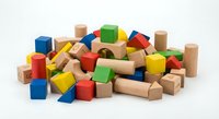 Colorful wooden building blocks scattered on white background. Educational toys for children development and creative play activities.