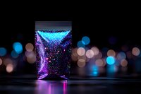 Glowing glass with sparkling purple liquid against blurred city lights background creates magical atmosphere with neon reflections and bokeh effects.