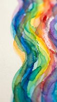 Vibrant watercolor paint flows in rainbow spectrum creating fluid organic waves with wet bleeding effects on textured paper for creative projects.