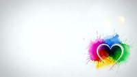Colorful heart with vibrant paint splashes and artistic brush strokes on clean white background for creative design projects and romantic themes.