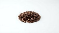 Roasted coffee beans pile on white background, suitable for beverage packaging, cafe menus, and culinary publications.