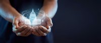 Businessman hands holding glowing government building hologram representing political leadership, democracy, and civic responsibility in modern digital age.