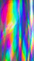 Vibrant holographic foil texture with rainbow spectrum colors creating iridescent light reflections and prismatic effects for modern digital backgrounds.