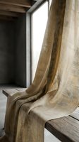 Natural linen fabric draped over wooden bench near window creating soft shadows and warm lighting for interior design and home decor concepts.