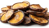 Fresh sliced shiitake mushrooms showing golden gills and dark brown caps on white background, macro food photography for culinary and cooking projects.