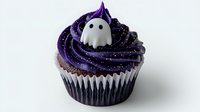 Halloween chocolate cupcake with purple swirled frosting and ghost decoration on top, sprinkled with black glitter against white background. Party dessert for fall season.