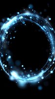 Glowing blue circular light trail with sparkles and bokeh effects on black background, creating magical energy ring portal effect.