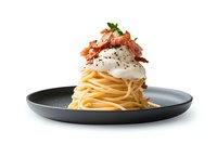 Spaghetti carbonara with poached egg, crispy bacon bits and fresh herbs served on dark plate, isolated on white background for menu photography.