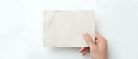 Hand holding blank white card mockup on clean background for branding design presentation and marketing materials showcase.