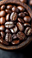 Fresh roasted coffee beans in wooden bowl, macro shot showing rich brown color and distinctive crack lines, natural morning light highlighting glossy surface.