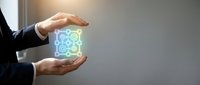 Businessman holding glowing neon gears icon between hands, representing technology innovation, industrial automation, and digital transformation solutions for business growth.