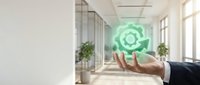 Businessman hand holding glowing green recycling symbol in modern office environment promoting sustainable business practices and environmental responsibility.