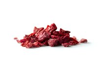 Dried red beetroot chips scattered on white background, healthy vegetable snack isolated with soft shadow, ready for design use in food packaging and advertising.
