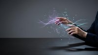 Businesswoman touching digital holographic interface with glowing particles and light waves emanating from fingertips, representing technology innovation and digital transformation for corporate presentations.