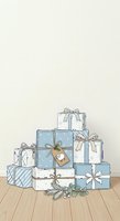 Stack of wrapped gift boxes in blue and white with bows and tags, decorated with evergreen branches and berries on wooden floor. Suitable for holiday greeting cards, seasonal marketing, and festive design projects.