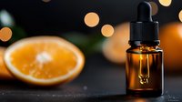 Amber glass dropper bottle with essential oil against blurred orange slice and warm bokeh lights. Natural aromatherapy and skincare concept on dark background.