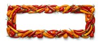 Twisted red and yellow chili peppers arranged in a rectangular frame border with white center space, suitable for food packaging, recipe cards, and culinary designs.