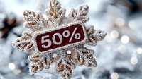 Decorative snowflake with 50 percent discount sign covered in frost and snow against blurred winter background with bokeh lights and sparkles.
