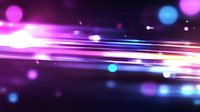 Abstract glowing light streaks with bokeh effects on purple and blue gradient background create dynamic motion and energy for technology designs.