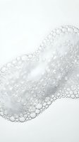 Abstract white foam bubbles floating on clean background creating organic texture pattern for cosmetic and skincare product design applications.