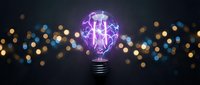 Glowing purple lightbulb with electric lightning effects against blurred bokeh lights background for innovation and creativity concepts.
