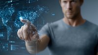 Caucasian man in gray shirt touching futuristic holographic interface with digital network connections and data visualization technology.