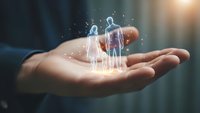 Businessman holding glowing holographic family figures in cupped hands representing life insurance, family protection and financial security concept.