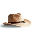 Traditional woven straw cowboy hat with braided leather band isolated on white background, ready for western-themed designs and commercial use.