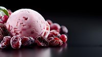 Pink ice cream scoop with frozen cranberries and cherries on dark background, close up view with selective focus and copy space for dessert menu.