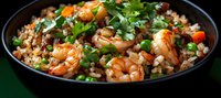 Savory shrimp fried rice garnished with fresh cilantro and vegetables in black bowl, close up view of Asian cuisine with colorful ingredients and tender seafood.