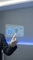 Businessman in dark suit touching holographic security interface with lock, shield, and network icons for data protection and cybersecurity solutions.