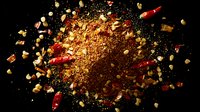 Explosive spices composition with red chili peppers and spice powder bursting on black background, dynamic food photography for culinary projects.